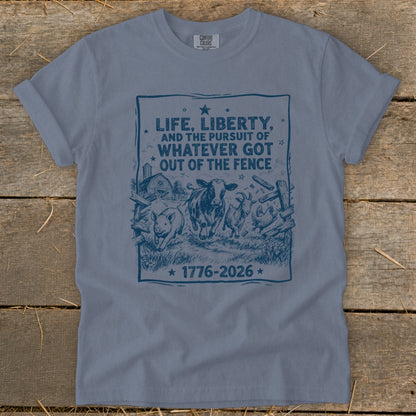 Blue t-shirt with farm animals and text about life, liberty, and the pursuit of what got out of the fence.