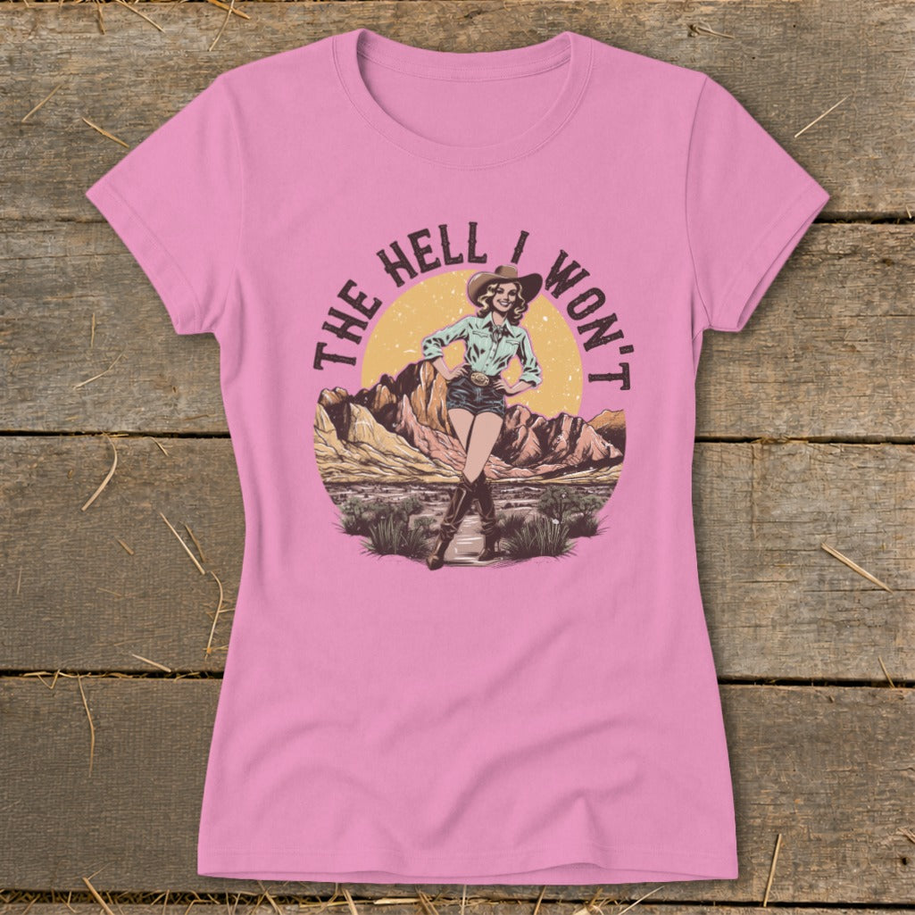 Pink t-shirt with a graphic of a cowgirl and desert landscape, text reads "The Hell I Won't".