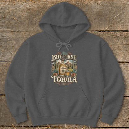 Dark gray hoodie with "But First, Tequila" graphic featuring a tequila bottle and shot glass.