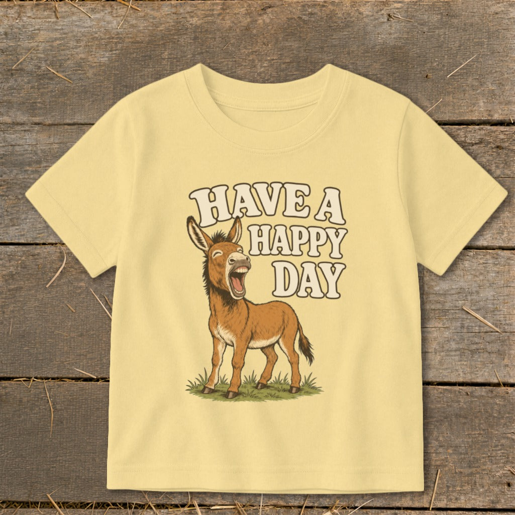 Light yellow t-shirt with cartoon donkey and text "HAVE A HAPPY DAY".