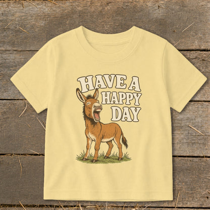 Light yellow t-shirt with cartoon donkey and text "HAVE A HAPPY DAY".