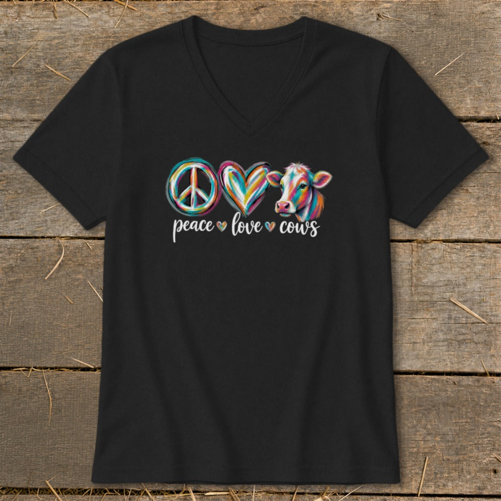 Black t-shirt with peace, love, and cow graphic and text.