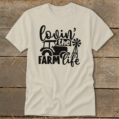Cream t-shirt with black graphic: tractor, windmill, and text "lovin' the FARM life".