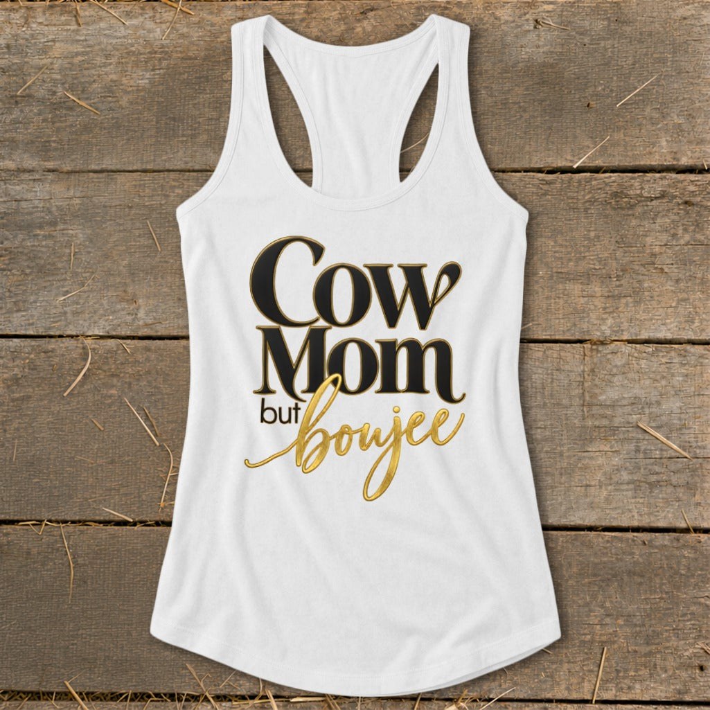 White tank top with "Cow Mom but boujee" text in black and gold.