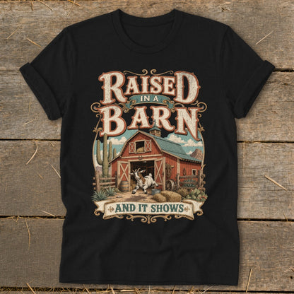 Black t-shirt with "Raised in a Barn and It Shows" text and a goat in front of a barn.