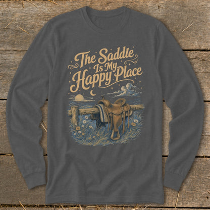 T-shirt graphic with text "The Saddle Is My Happy Place" and a saddle on a fence.
