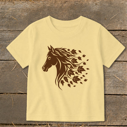 Pale yellow t-shirt with a brown horse head and falling leaves design.