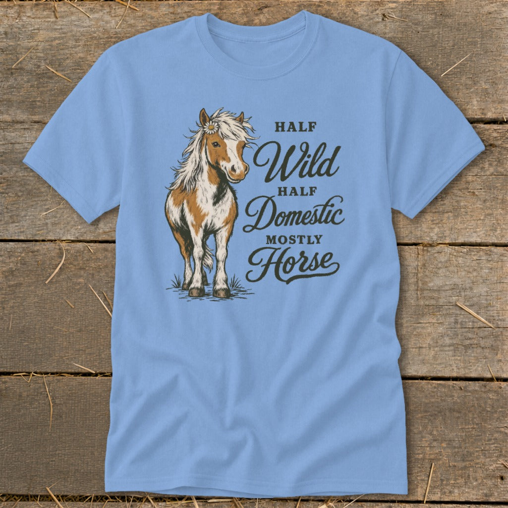 Light blue t-shirt with a brown and white horse and text reading "Half Wild, Half Domestic, Mostly Horse".