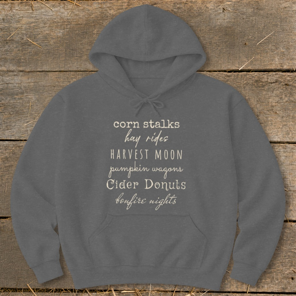 Gray hoodie with "corn stalks hay rides harvest moon pumpkin wagons cider donuts bonfire nights" text.