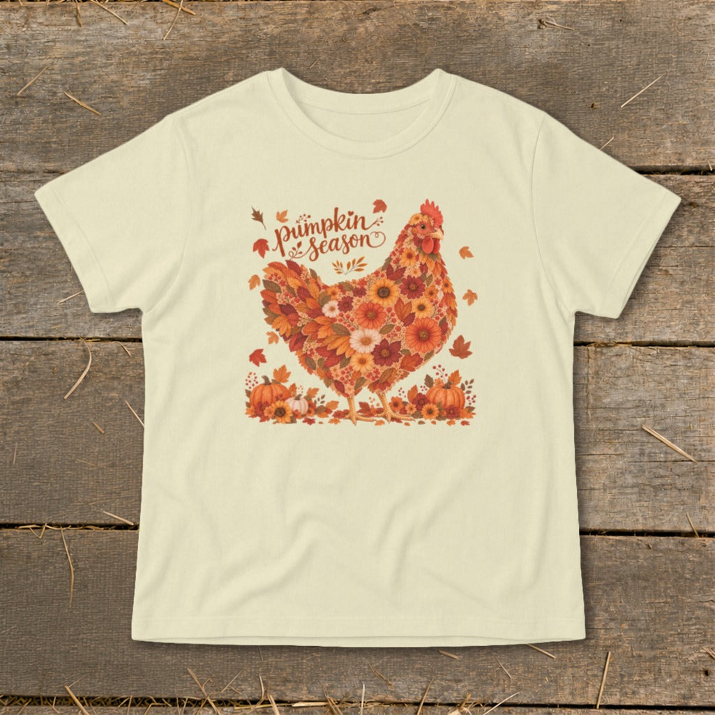Light yellow t-shirt with a chicken design made of fall leaves and flowers and text "pumpkin season".
