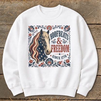 White sweatshirt with horse and "Hoofbeats & Freedom Since 1776" design.
