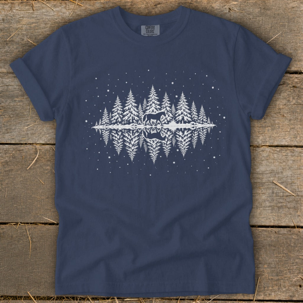 Navy t-shirt with white graphic of a horse in a snowy forest reflected in water.