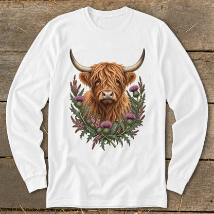 White long-sleeved shirt with a Highland cow and thistles graphic.