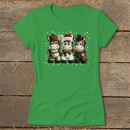 Three cartoon horses with holiday scarves and Santa hat stand with snowflakes.