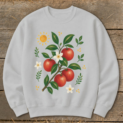 Light grey sweatshirt with a branch of red apples, white blossoms, green leaves, and a sun.
