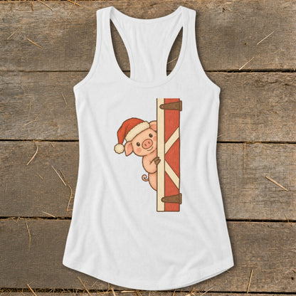 White tank top with a cute pig wearing a Santa hat peeking from a barn door.