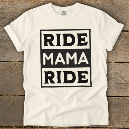 Cream t-shirt with black text reading "RIDE MAMA RIDE" in a central box.