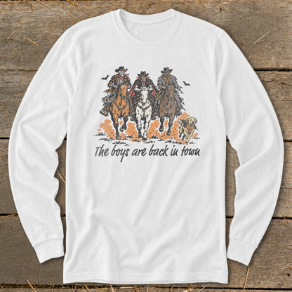 Skeleton, vampire, and zombie cowboys ride horses with a dog; text reads "The boys are back in town".