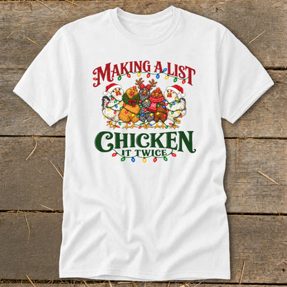 White t-shirt with "Making a List, Chicken it Twice" text and festive chickens.