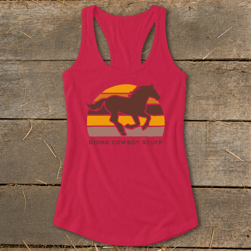 Red tank top with a running horse graphic and "DOING COWBOY STUFF" text.