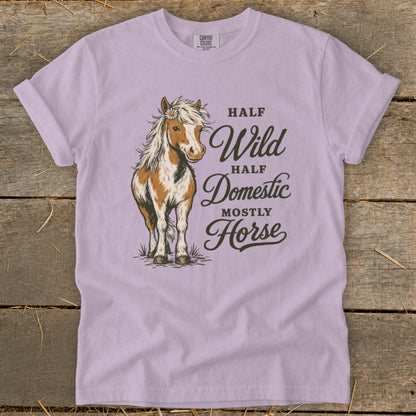 Lavender t-shirt with a standing horse graphic and text "Half Wild, Half Domestic, Mostly Horse".