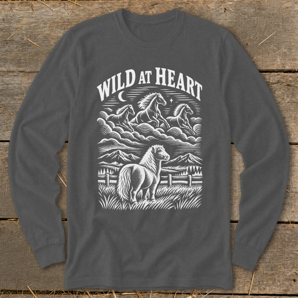 Long sleeve shirt with "Wild at Heart" text and a graphic of horses and mountains.