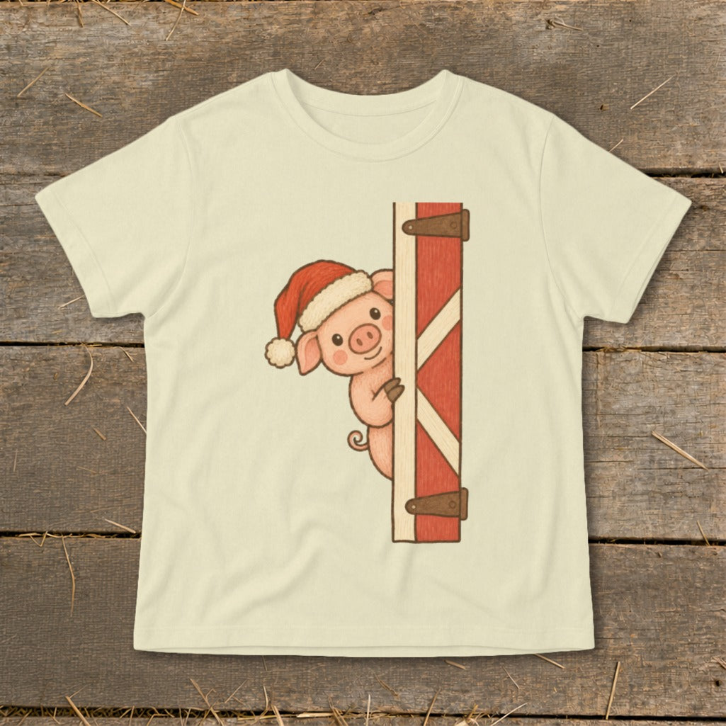 Christmas pig wearing Santa hat peeking around a red wooden door.