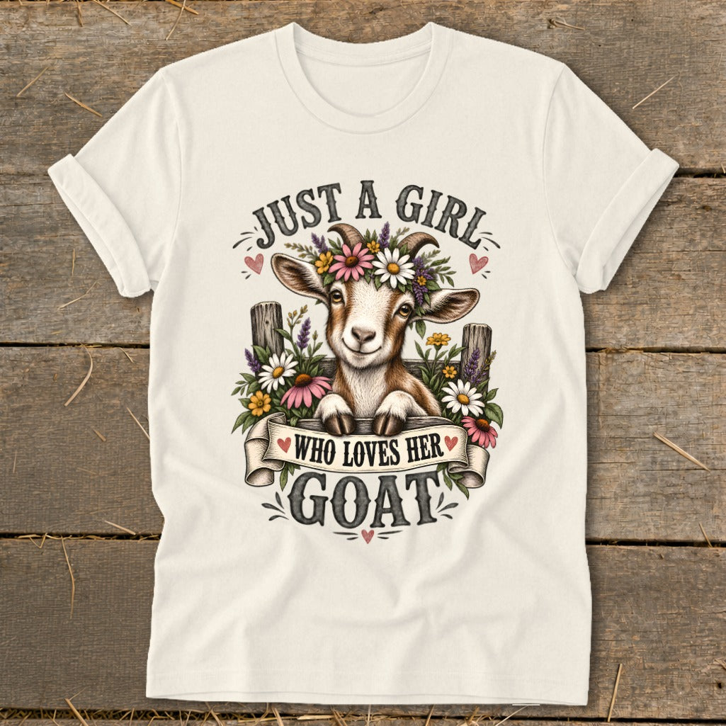 Cream t-shirt with a cartoon goat wearing flowers and text "JUST A GIRL WHO LOVES HER GOAT".