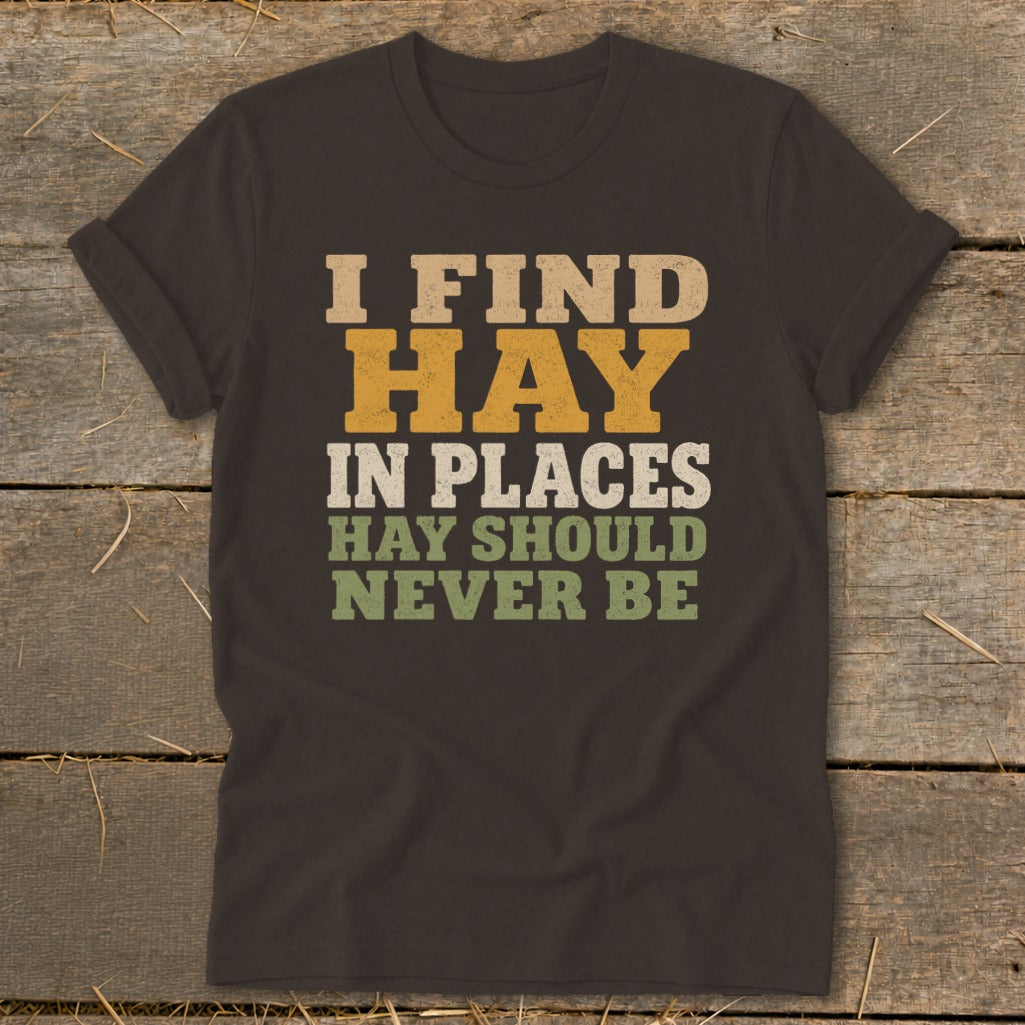 Dark t-shirt with "I FIND HAY IN PLACES HAY SHOULD NEVER BE" text.