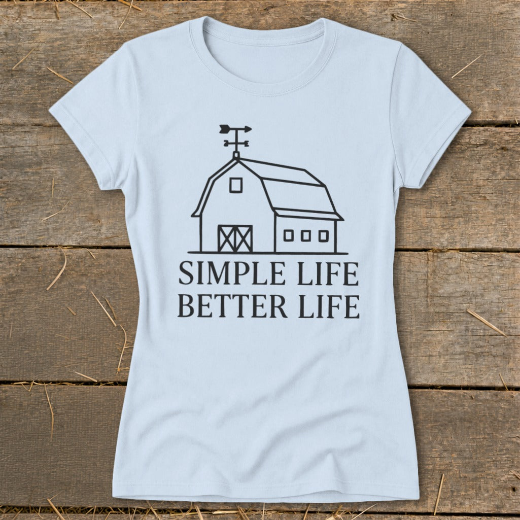 Light blue t-shirt with line art barn graphic and text "SIMPLE LIFE BETTER LIFE".