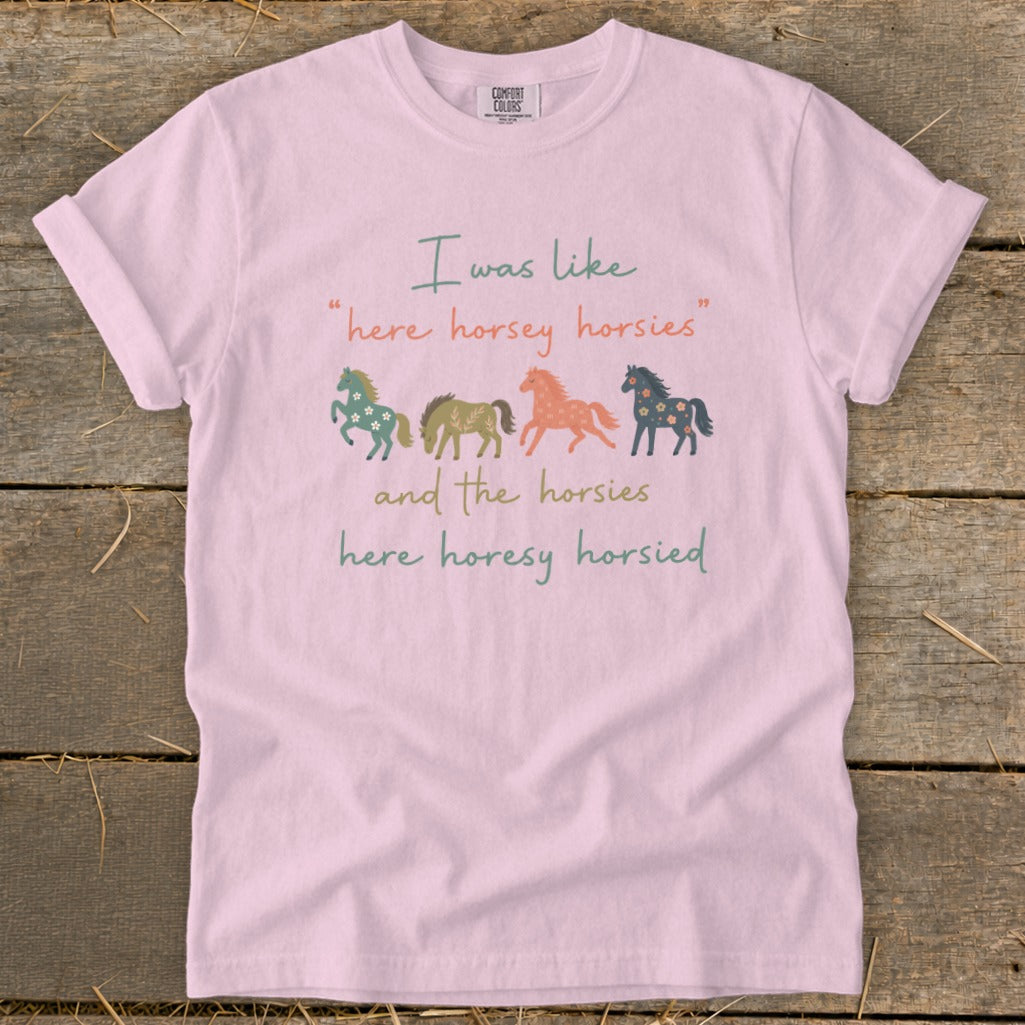 Pink t-shirt with "I was like 'here horsey horsies' and the horsies here horesy horsied" text and four illustrated horses.