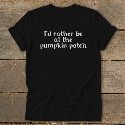 Black t-shirt with white text "I'd rather be at the pumpkin patch".