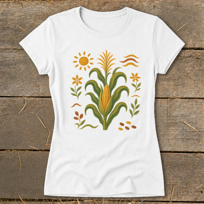 White t-shirt with a central corn stalk design featuring a sun and flowers.