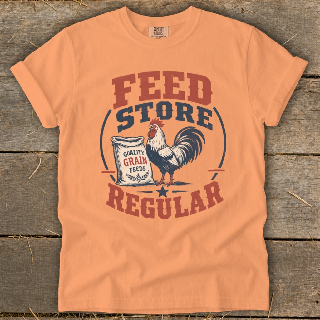 Orange t-shirt with "FEED STORE REGULAR" text, a rooster, and a bag of grain.