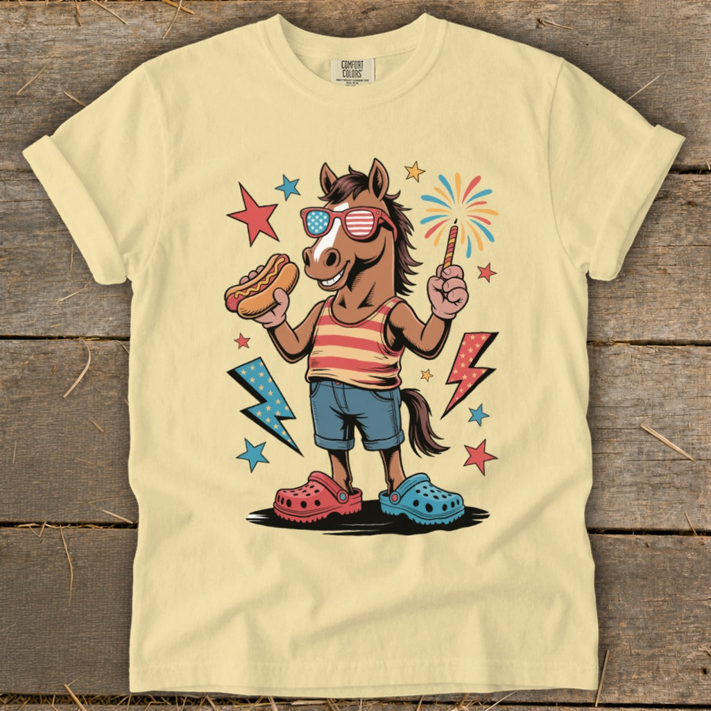 Horse with hot dog and sparkler, wearing sunglasses and patriotic clothing.