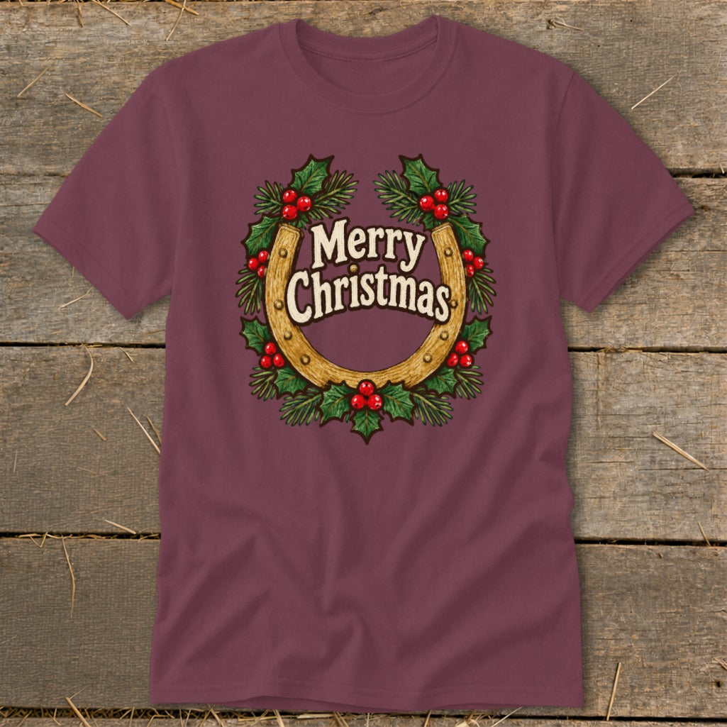 Maroon t-shirt with horseshoe and holly wreath graphic saying "Merry Christmas."