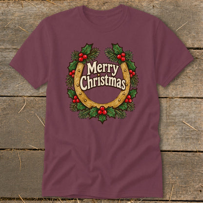 Maroon t-shirt with horseshoe and holly wreath graphic saying "Merry Christmas."