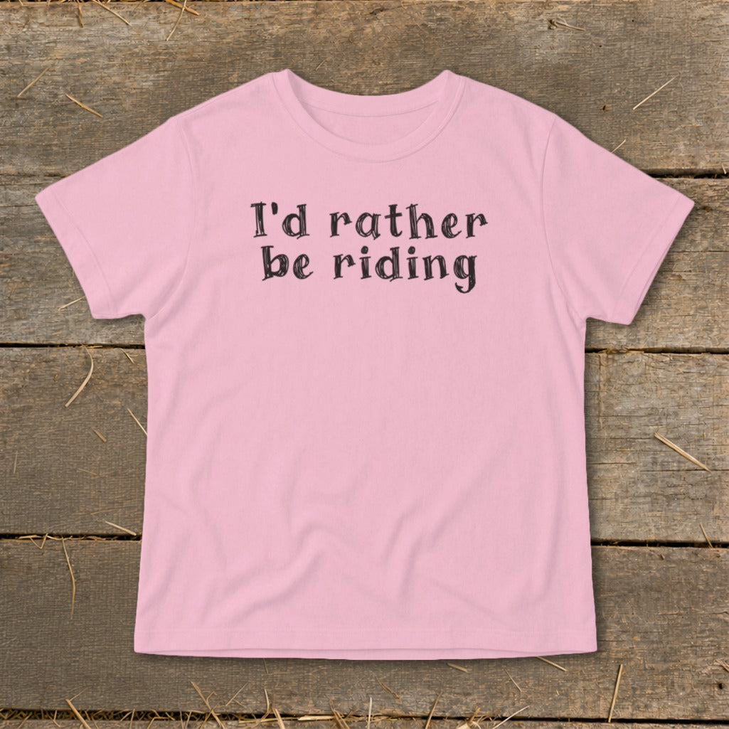 Pink t-shirt with black text reading "I'd rather be riding".