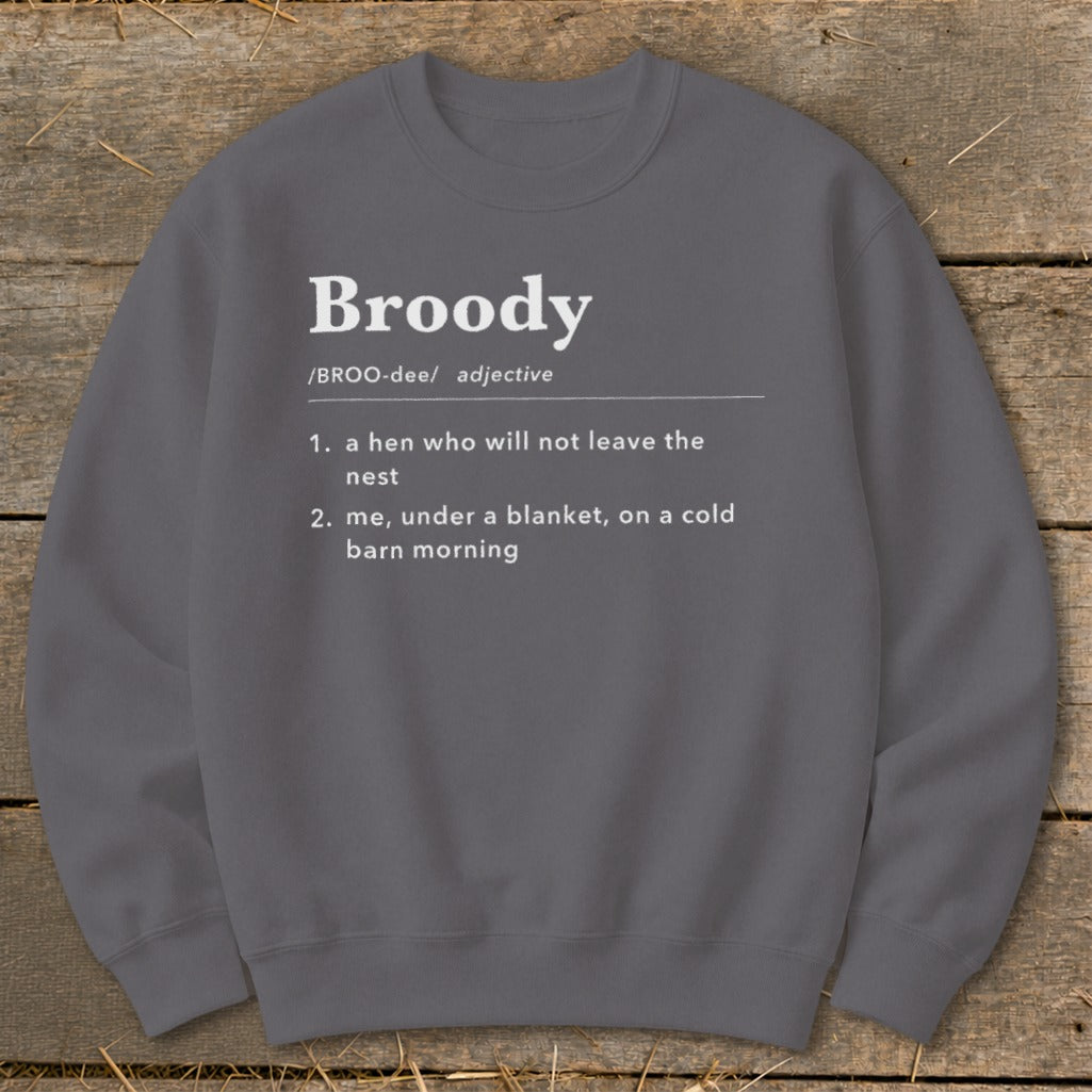Gray sweatshirt with "Broody" definition: hen in nest, or under blanket.