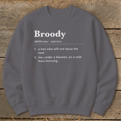 Gray sweatshirt with "Broody" definition: hen in nest, or under blanket.