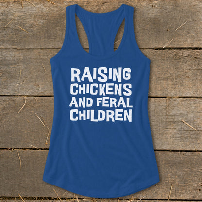 Blue tank top with white text reading "RAISING CHICKENS AND FERAL CHILDREN."