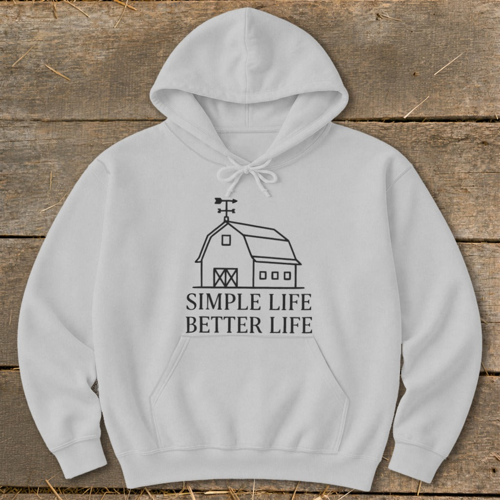 White hoodie with a black line drawing of a barn and text "Simple Life Better Life".