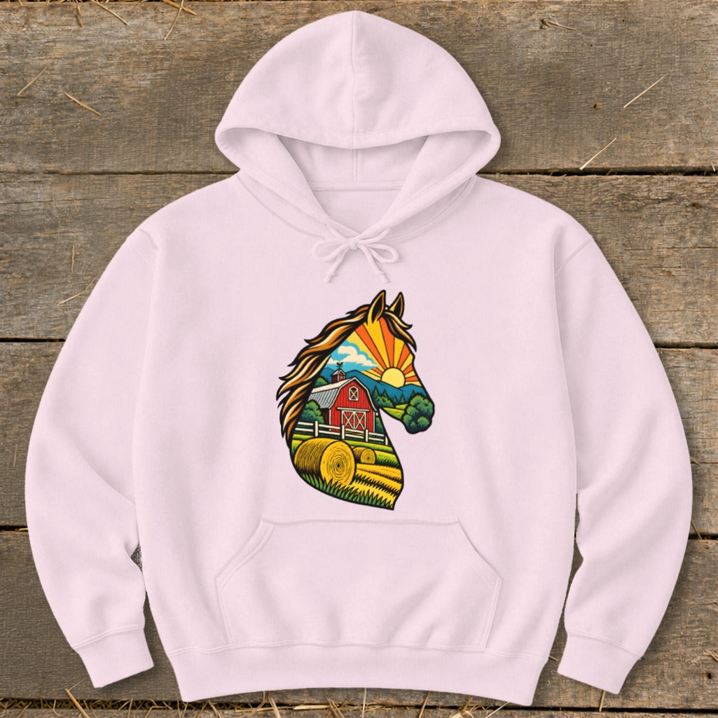 Light pink hooded sweatshirt with a graphic of a horse head containing a farm scene.