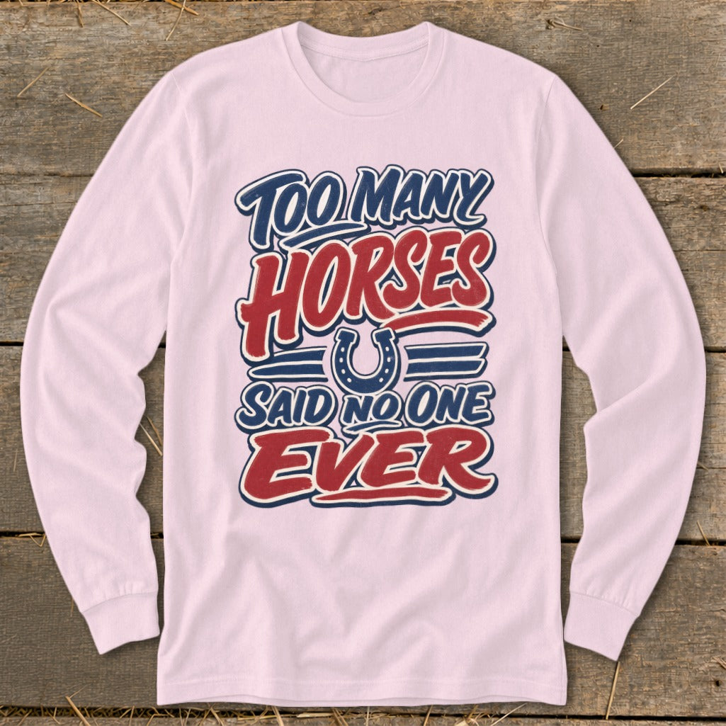 Pink long-sleeved shirt with "Too Many Horses Said No One Ever" text and horseshoe graphic.
