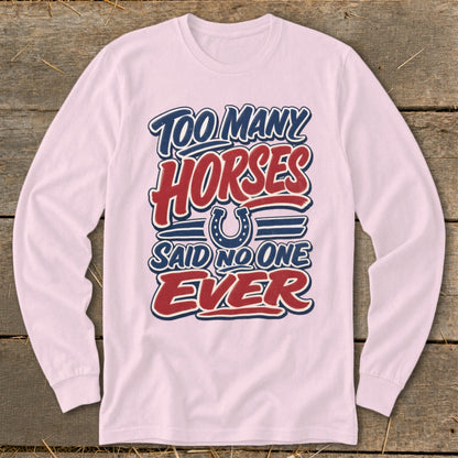 Pink long-sleeved shirt with "Too Many Horses Said No One Ever" text and horseshoe graphic.