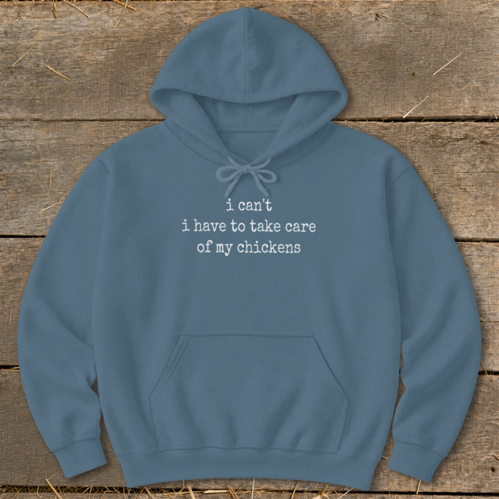 Blue hoodie with "I can't I have to take care of my chickens" text.
