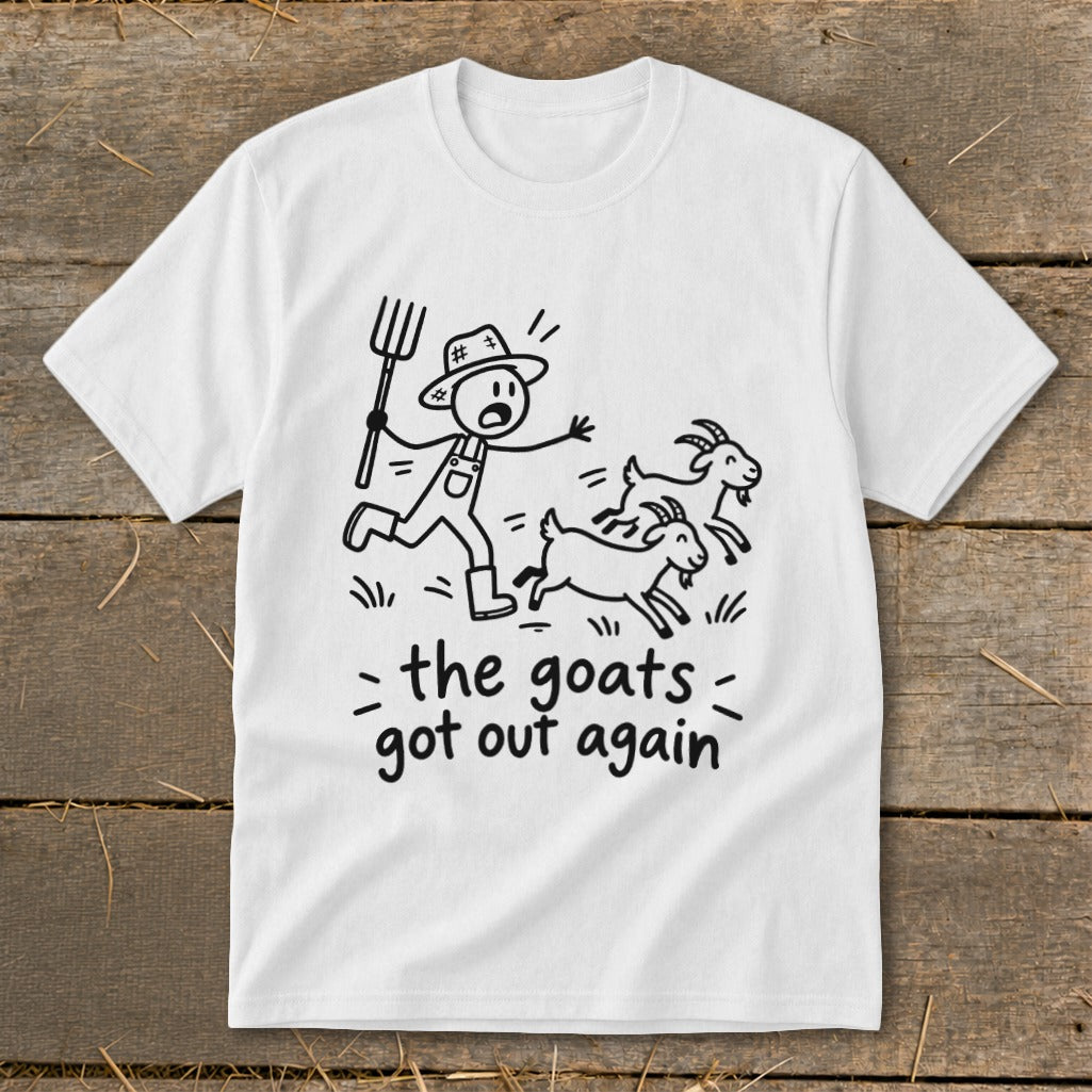 White t-shirt with a drawing of a farmer chasing three goats and text "the goats got out again".