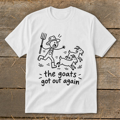 White t-shirt with a drawing of a farmer chasing three goats and text "the goats got out again".