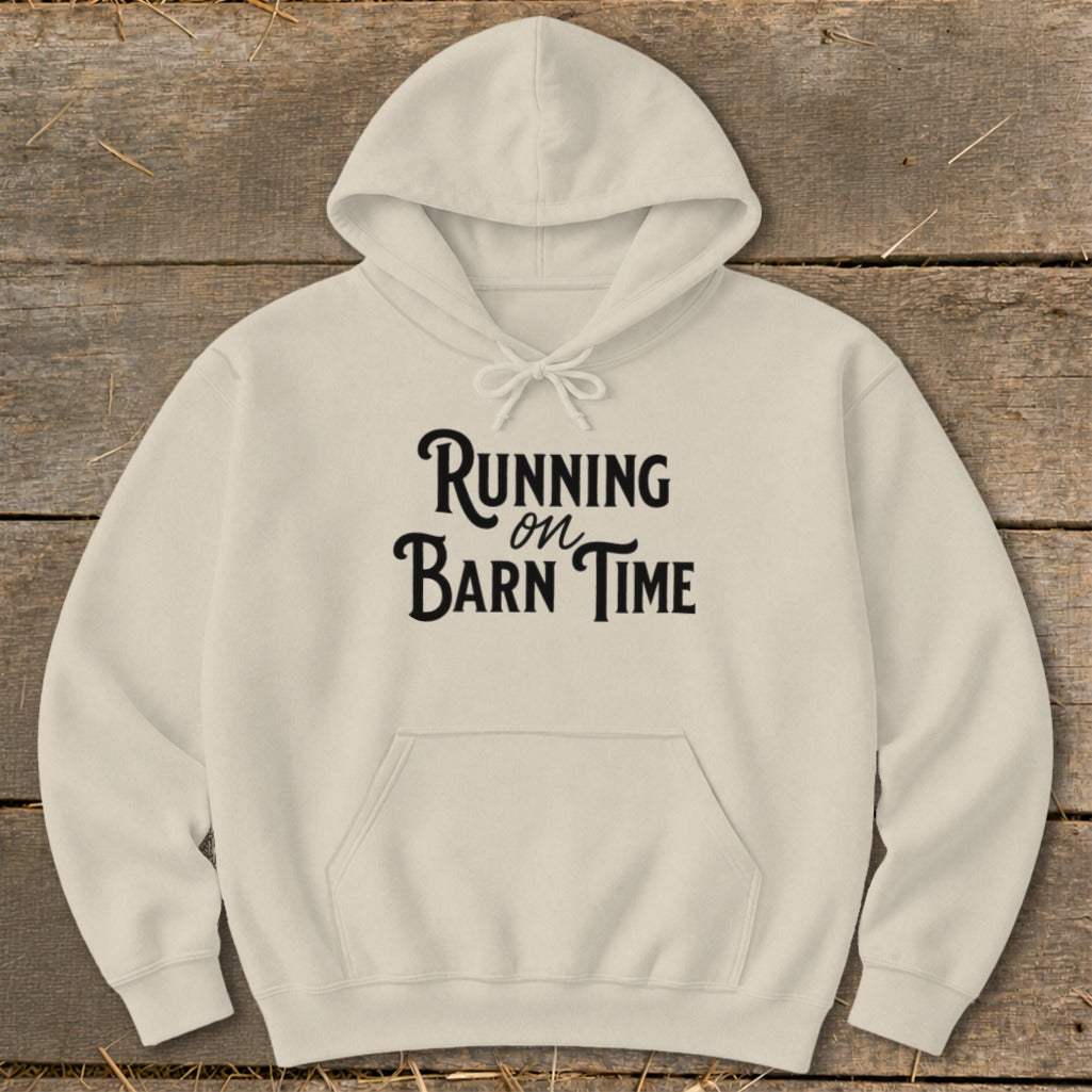 Cream hoodie with black text "Running on Barn Time" printed on the front.