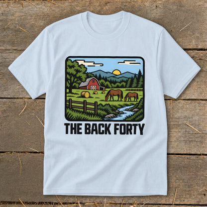Light blue t-shirt featuring a retro countryside illustration with horses, a barn, and the text THE BACK FORTY.